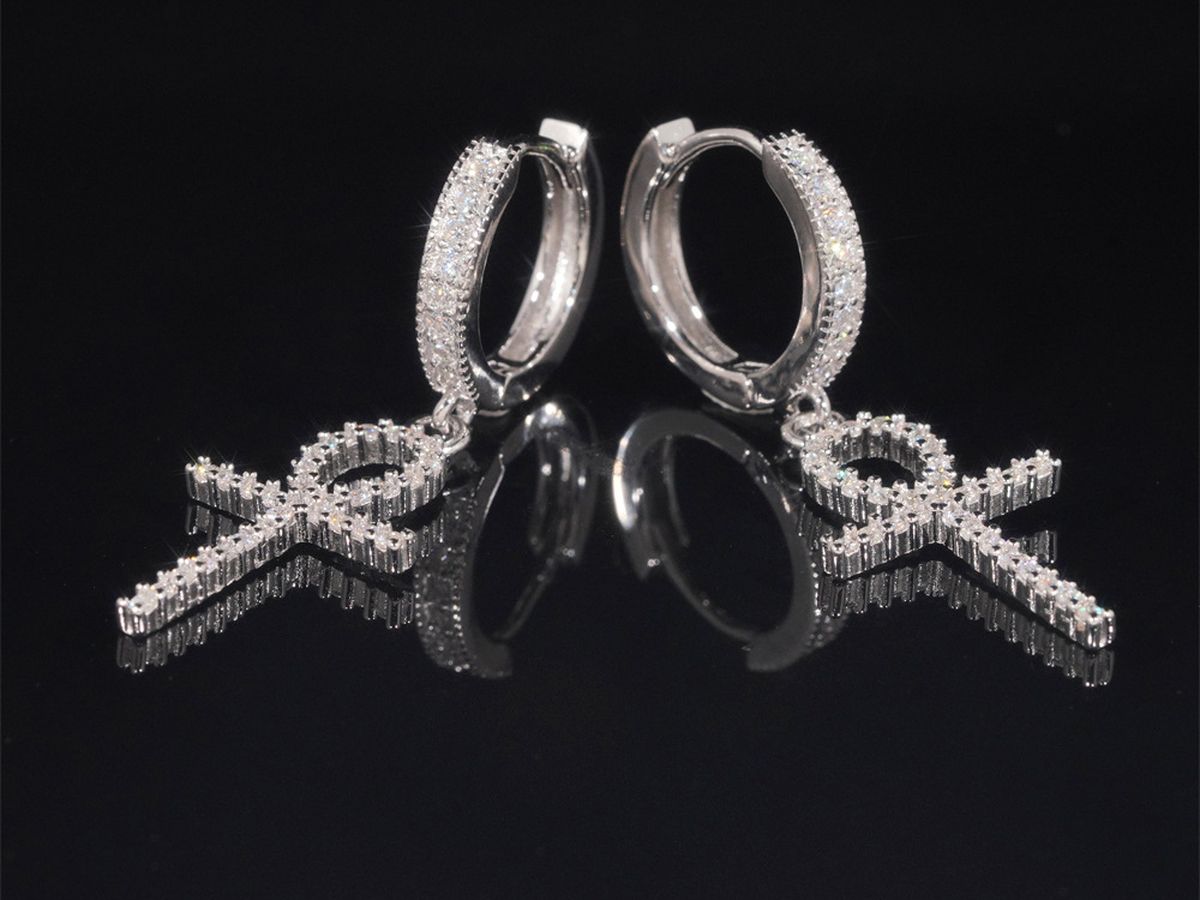 Moissanite hoop earrings in 925 sterling silver with hand-set stones along the hoop