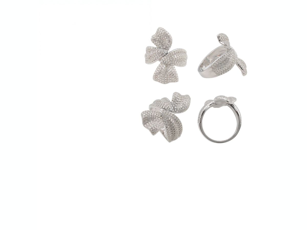 Moissanite bow knot ring in 925 sterling silver with stones set across the design