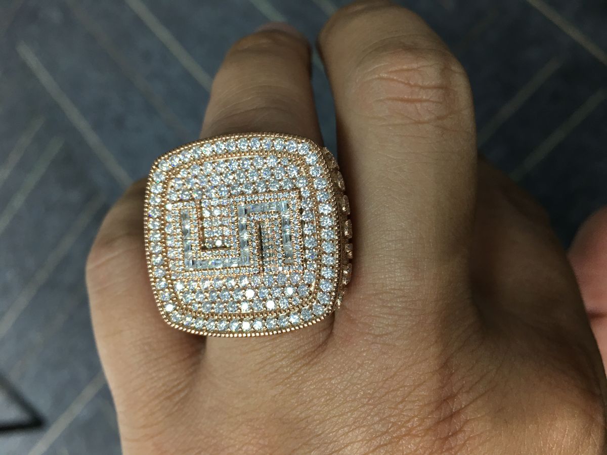 Paved moissanite band in 925 sterling silver worn on the hand, rows of round and baguette stones hand-set across the band