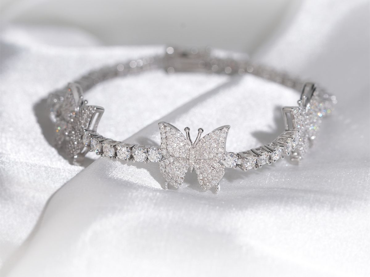 Moissanite tennis bracelet with 3mm butterfly links in 925 sterling silver, hand-set stones